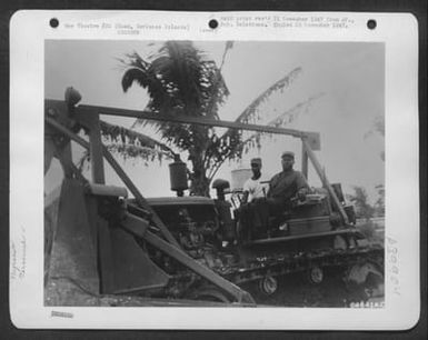 Sgt. C. B. Williams, 518 Roosevelt Street, Longview, Texas, And Cpl. William Goodwin, Abbeville, South Carolina, Are Shown At The Gears Of A Bulldozer While Clearing Jungle In The Twentieth Air Force Headquarters Area On Guam, Marianas Islands. Only Thro (U.S. Air Force Number 64641AC)