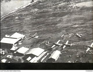 Lae, New Guinea. 1937. Aerial view of hangars and aircraft at the airfield at Lae, used by Guinea Airways