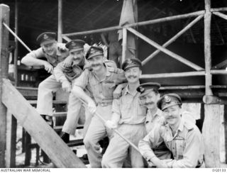 MILNE BAY, PAPUA NEW GUINEA. C. 1943-10-30. FAMOUS FOR THEIR MOUSTACHES, MEMBERS OF NO. 6 (BEAUFORT) SQUADRON RAAF. LEFT TO RIGHT: WING COMMANDER W. G. LEER DFC AFC; SQUADRON LEADER (SQN LDR) D. G. ..