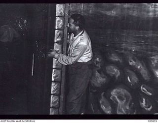 RABAUL, NEW BRITAIN, 1946-02-06. SCENE SHIFTERS CHANGING SCENERY BETWEEN THE ACTS DURING THE PERFORMANCE OF THE MUSICAL COMEDY "THE MAID OF THE MOUNTAINS", BY MEMBERS OF 6 ENTERTAINMENT UNIT, ..