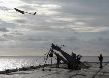 An unmanned aerial vehicle (UAV) called the"Scan Eagle"launches from the flight deck of the U.S. Navy Tarawa Class Amphibious Assault Ship USS SAIPAN (LHA 2) during operations in the Atlantic Ocean on Aug. 18, 2006. The"Scan Eagle"is designed to provide persistent intelligence, surveillance and reconnaissance data, battle damage assessment and communications relay in support of the Global War On Terrorism. (U.S. Navy photo by Mass Communication SPECIALIST SEAMAN Patrick W. Mullen III) (Released)