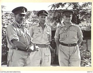 LAE AREA, NEW GUINEA, 1945-08-04. LIEUTENANT-GENERAL B.M. MORRIS, GENERAL OFFICER COMMANDING AUSTRALIAN NEW GUINEA ADMINISTRATIVE UNIT (1) AND COLONEL I.J. WOOD, COMMANDING OFFICER 2/7 GENERAL ..