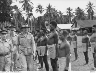 LAE AREA, NEW GUINEA, 1945-06-28. DURING HIS TOUR OF INSPECTION OF AUSTRALIAN TROOPS IN THE LAE AREA, HIS ROYAL HIGHNESS, THE DUKE OF GLOUCESTER, GOVERNOR-GENERAL OF AUSTRALIA (1) INSPECTED THE ..