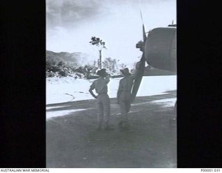 THE SOLOMON ISLANDS, 1945-01-12. RAAF PERSONNEL AND AIRCRAFT AT PIVA AIRSTRIP. (RNZAF OFFICIAL PHOTOGRAPH.)