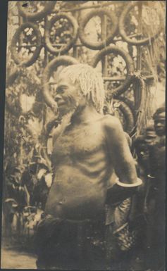 Chief in front of currency, Toma, New Guinea, ca 1930 / Sarah Chinnery