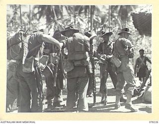 AITAPE, NEW GUINEA. 1945-01-08. PERSONNEL OF "JOCK FORCE", 2/2ND INFANTRY BATTALION PREPARING TO MOVE OUT FROM THE AUSTRALIAN AND NEW GUINEA ADMINISTRATION UNIT HEADQUARTERS AT THE START OF THEIR ..