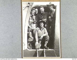 DUMPU, RAMU VALLEY, NEW GUINEA. 1944-01-01. PERSONNEL OF THE 2/25TH INFANTRY BATTALION IN A TRANSPORT AIRCRAFT JUST BEFORE TAKING OFF FROM THE AIRSTRIP FOR PORT MORESBY. SHOWN ARE: QX52540 PRIVATE ..