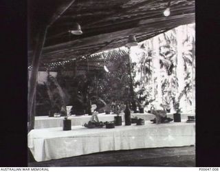 MILNE BAY, PAPUA, C.1942 - 12. NO. 37 RAAF RADAR STATION MESS SET FOR CHRISTMAS DINNER. (DONOR - T.G. JONES)