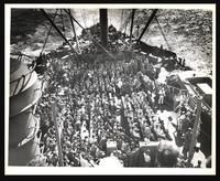 Coast Guardsmen and Marines on boat deck at Lenten Mass