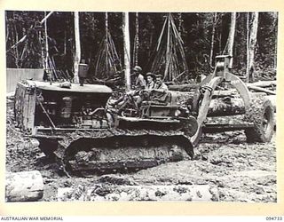 YALU AREA, NEW GUINEA, 1945-07-30. LOGGING ARCH AND D8 TRACTOR OPERATED BY NO. 2 PLATOON, 2/1 FORESTRY COMPANY, ROYAL AUSTRALIAN ENGINEERS