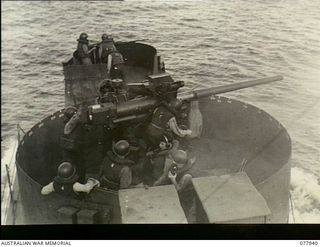 Puriata River Area, Bougainville. 1944-12-31. A 3 inch 50 calibre Dual Purpose Gun on a modified United States Landing Craft Infantry gunboat firing on Japanese positions in the area during a ..