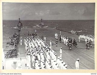 Rabaul, New Britain. 1945-09-06. Members of the Ship's Company of the Aircraft Carrier HMS Glory drawn up for the ceremony of surrender of all Japanese Forces in New Guinea, New Britain, New ..