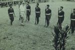 Dave Calder, PO [Patrol Officer] inspects police, Lake Murray, [Papua New Guinea], 1952