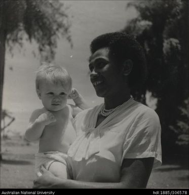 Fijian woman holding child