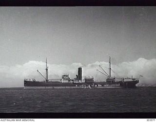 PORT MORESBY, PAPUA. 1941-09-19. PORT SIDE VIEW OF THE BRITISH CARGO VESSEL SS MANGOLA WHICH FORMED PART OF CONVOY MS.3 CARRYING STORES TO JAVA AND RETURNING TO FREMANTLE WITH CONVOY SJ.6 IN ..