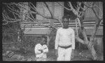 Man and boy near a building