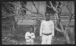 Man and boy near a building