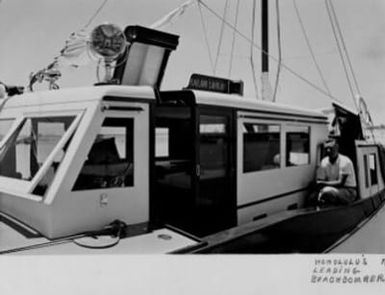Black and white photographs of Doris Duke's cruiser, Kailani LahiLahi, in Hawaii, during repairs and then ready to sail. Also includes 1 photo of Kimo with its new cover, circa 1938