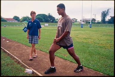 Young male athlete stretching,Tonga