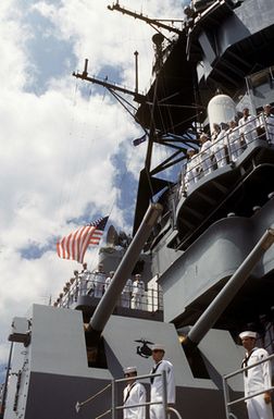 Sailors man the rails of the battleshp USS MISSOURI (BB 63) during a re-enactment of the Great White Fleet's salute to Kalaupapa which took place in 1908. Kalaupapa is a leper settlement located on the northern coast of Molokai, Hawaii