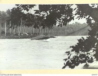 MILILAT, NEW GUINEA. 1944. THE AUSTRALIAN ARMY MEDICAL SERVICES LAUNCH, AM8, BENG TOSSED ABOUT IN THE HEAVY SEAS NEAR THE BEACH