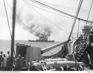 OFF NAURU, 1940-06-12. THE ITALIAN MERCHANT VESSEL ROMOLO BEING SCUTTLED AFTER INTERCEPTION BY HMAS MANOORA. (DONATED BY G. WESTLAKE)