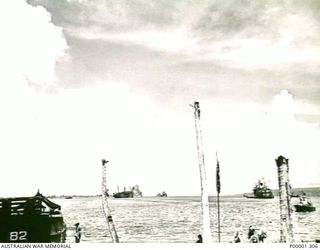 NEW BRITAIN, 1945-09. VIEW FROM THE SHORE OF ALLIED SHIPPING IN SIMPSON HARBOUR, RABAUL. (RNZAF OFFICIAL PHOTOGRAPH.)