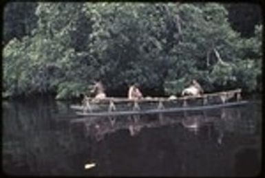 Canoe used for coastal transport, baskets and bundles on platform