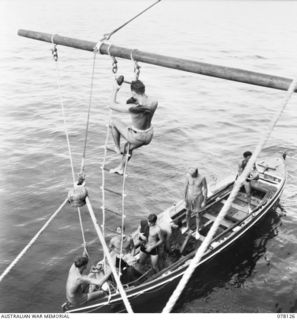 MIOS WUNDI, DUTCH NEW GUINEA. 1944-11-17. RATINGS COMING ABOARD THE ROYAL AUSTRALIAN NAVY CORVETTE HMAS GLENELG BY WAY OF THE SHIPS LOWER BOOM