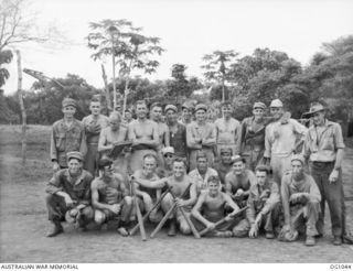 KIRIWINA, TROBRIAND ISLANDS, PAPUA. C. 1944-03. GROUP PORTRAIT OF US BASEBALL PLAYERS WITH THE US FORCES WHO WON A MATCH AGAINST MEMBERS OF NO. 30 (BEAUFIGHTER) SQUADRON RAAF. THE AMERICANS SAID ..