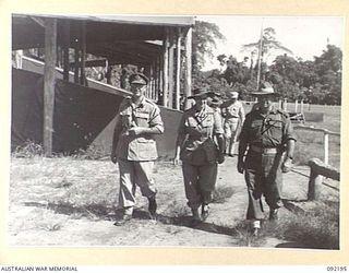 BOUGAINVILLE, NEW GUINEA. 1945-05-18. LIEUTENANT GENERAL S.G. SAVIGE, GENERAL OFFICER COMMANDING 2 CORPS (1), ACCOMPANIED BY MATRON M.E. HURLEY, AUSTRALIAN ARMY NURSING SERVICE (2), AND BRIGADIER ..