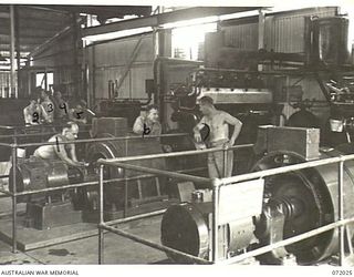 MILNE BAY, NEW GUINEA. 1944-04-04. QX55051 SAPPER P.A. PEAREN (6), WITH PERSONNEL OF THE 5TH ARMY TROOPS COMPANY, QUEENSLAND LINES OF COMMUNICATION AREA, ROYAL AUSTRALIAN ENGINEERS WORKING ON ..