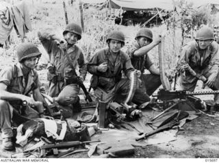 1943-09-15. PARATROOPS LAND AT NADZAB. U.S. PARATROOPS PACKING THEIR EQUIPMENT LAST SUNDAY BEFORE BOARDING ONE OF THE NUMEROUS TRANSPORT PLANES WHICH LED BY GENERAL MACARTHUR IN A FLYING FORTRESS, ..