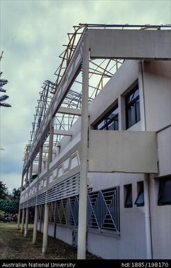 New Caledonia - white building with metal pipe designs on roof