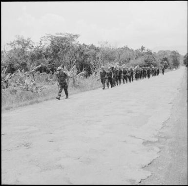 Soldiers marching on the side of the road, New Caledonia, 1969 / Michael Terry