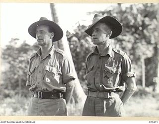 MILILAT, NEW GUINEA. 1944-08-23. VX4503 CAPTAIN C.H. JENKINS, OFFICER- IN- CHARGE (1) AND NX56289 WARRANT OFFICER II, S.R. BALL, COMPANY SERGEANT MAJOR, HEADQUARTERS G COMPANY, 2/1ST GUARD REGIMENT