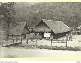 PORT MORESBY, NEW GUINEA. 1944-01-22. RECREATION HUT AND BARBERS SHOP BUILT BY THE 2/101ST GENERAL TRANSPORT COMPANY IN THE CAMP AREA. BOTH WERE FURNISHED AND GAMES WERE SUPPLIED BY THE AUSTRALIAN ..