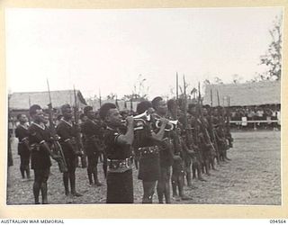 TOROKINA, BOUGAINVILLE, 1945-08-04. MEMBERS OF THE ROYAL PAPUAN CONSTABULARY DURING INSPECTION BY LIEUTENANT-GENERAL S.G. SAVIGE, GENERAL OFFICER COMMANDING 2 CORPS. LIEUTENANT-GENERAL SAVIGE ..