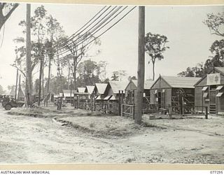 TOROKINA AREA, BOUGAINVILLE ISLAND. 1944-12-01. THE BUILDINGS OCCUPIED BY THE ANCILLIARY UNITS AND SECTIONS OF HEADQUARTERS, 4TH BASE SUB AREA. BUILDINGS FROM RIGHT ARE OCCUPIED BY:- AUSTRALIAN ..