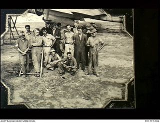 Port Moresby, Papua. 1942. Informal group portrait of the ground crew of `B' Flight, No. 30 Squadron RAAF under the wing of one of the squadron's Beaufighter aircraft. Left to right: standing: ..