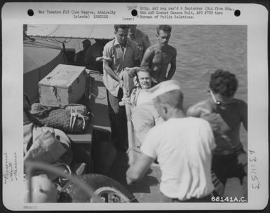 A United States submarine rescued flyers of two 13th Air Force bombers of the 394th Bomb Squadron, 5th Bomb Group, who were shot down by Jap "Zekes" on a mission over Yap Island in the Caroline Group. The flyers were transferred to a crash boat (U.S. Air Force Number 68141AC)