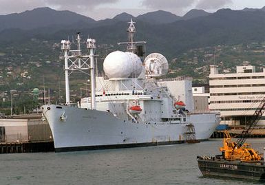 The Military Sealift Command missile range instrumentation ship USNS OBSERVATION ISLAND (T-AGM-23) lies tied up at the naval station.