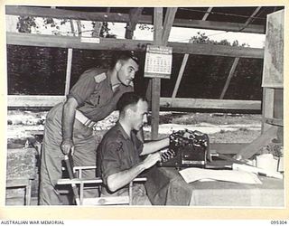 PALMALMAL PLANTATION, JACQUINOT BAY, NEW BRITAIN, 1945-08-15. WARRANT OFFICER 1 B. JONES, EDITOR OF THE DIVISIONAL NEWSPAPER "GARAMUT" GETS HIS VICTORY EDITION INTO PRINT AFTER SPENDING ALL NIGHT ..