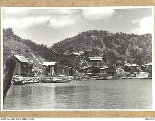 NAPA NAPA, NEW GUINEA. 1943-11-12. 2ND AUSTRALIAN WATERCRAFT WORKSHOPS, AUSTRALIAN ELECTRICAL AND MECHANICAL ENGINEERS TAKEN FROM A VESSEL IN THE HARBOUR