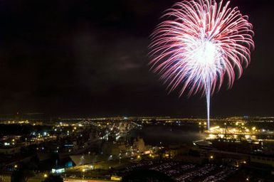 A spectacular fireworks display light up the night sky above the multi-national ships involved in the Rim of the Pacific (RIMPAC) 2006 Exercise during the 4th of July celebration held at Naval Base (NB) Pearl Harbor, Hawaii (HI). RIMPAC 2006 brings together military forces from Australia, Canada, Chile, Peru, Japan, the Republic of Korea, the United Kingdom and the US