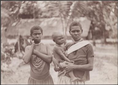 Two women, one of whom is holding a young child, at Loh, Torres Islands, 1906 / J.W. Beattie