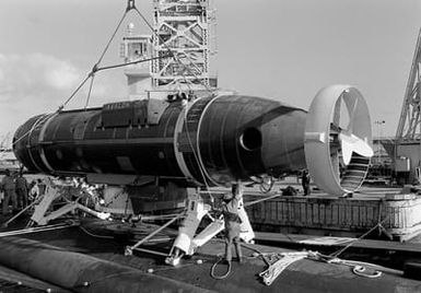 The deep submergence rescue vehicle AVALON (DSRV-2) is lowered onto the pylons aboard the nuclear-powered attack submarine USS CAVALLA (SSN-684). The AVALON and CAVALLA are taking part in a fly-away exercise to train personnel in the handling and operation of the DSRV