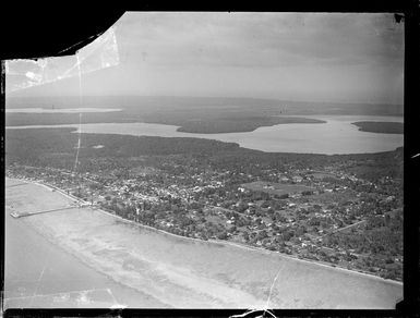 An aerial view of the Tongan coastal capital Nuku'alofa with the Lagoons of Fanga'uta and Fanga Kakau beyond, Tonga