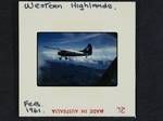 [View of aircraft taken from another aircraft, flying over mountain ranges], Western Highlands, [Papua New Guinea], Feb 1961