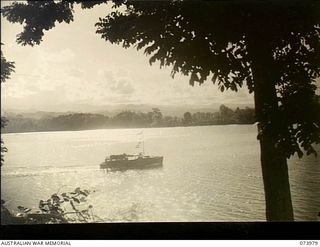 ALEXISHAFEN, NEW GUINEA. 1944-06-10. THE MEDICAL LAUNCH OF 2/15TH FIELD AMBULANCE CROSSING THE HARBOUR BOUND FOR MADANG